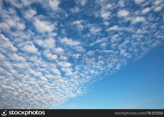 Sunny background, blue sky with white clouds, natural background.