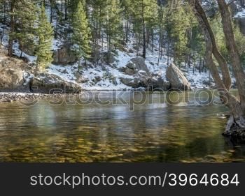 sunny day on the Cache la Poudre River above Fort Collins, Colorado - typical winter low flow at Picnic Rock
