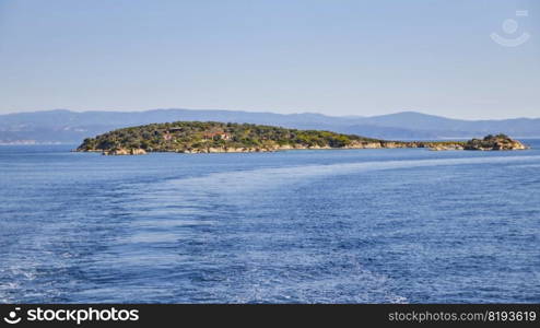 Sunny island and blue water view