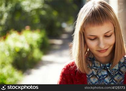 sunny light, young blonde woman dreaming , focus point on eye
