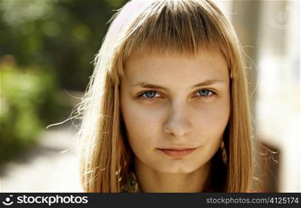 sunny light, young blonde woman dreaming , focus point on eye