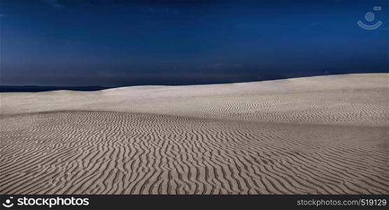 Sunny midday. Moving sand dunes at Slowinski National Park near Leba, Pomeranian Voivodeship, Poland.
