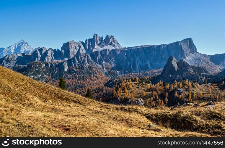 Sunny picturesque autumn alpine Dolomites rocky mountain view from hiking path from Giau Pass to Cinque Torri (Five pillars or towers) rock famous formation, Sudtirol, Italy.