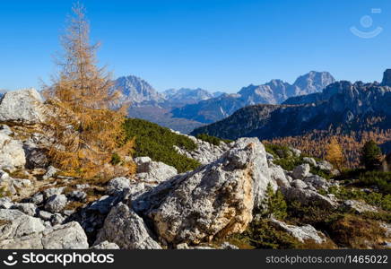 Sunny picturesque autumn alpine Dolomites rocky mountain view from hiking path from Giau Pass to Cinque Torri (Five pillars or towers) rock famous formation, Sudtirol, Italy.