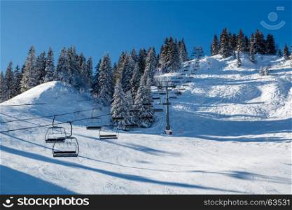 Sunny Ski Slope and Ski Lift near Megeve in French Alps, France