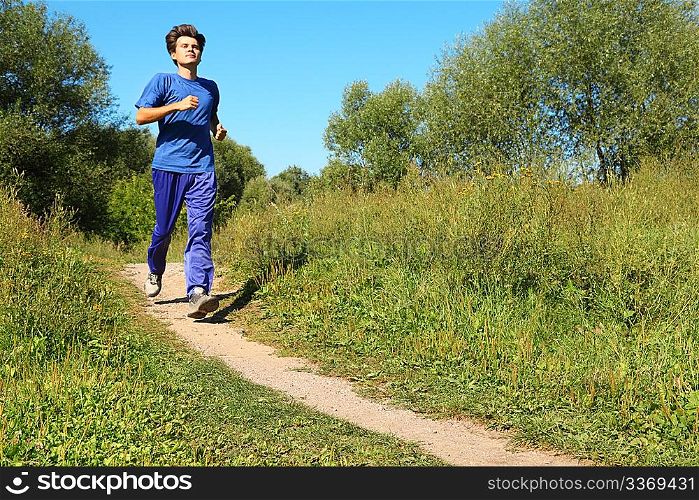 sunny summer day. one man wearing sporty clothes is running.