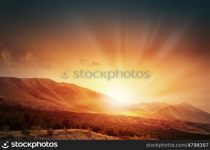 Sunrise above mountain . Natural landscape and sun rising at skyline