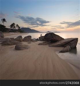 Sunrise at rocky coast of Lamai beach, Koh Samui Island, Thailand