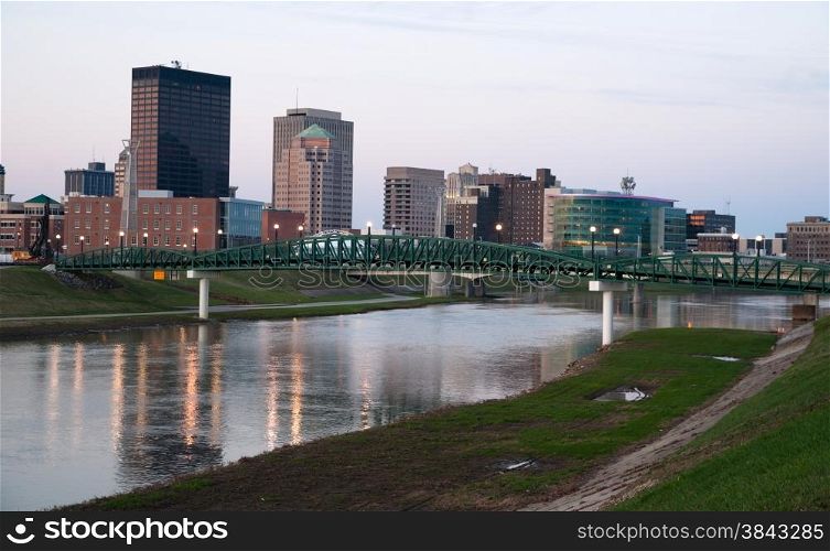 Sunrise comes to the Miami River flowing through Dayton Ohio
