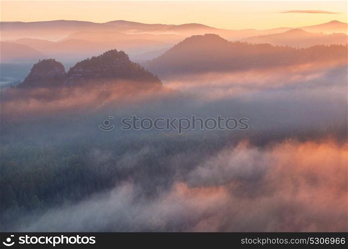 sunrise from Kleiner Winterberg, Saxon Switzerland. sunrise from foggy Kleiner Winterberg in the national park Saxon Switzerland, Germany