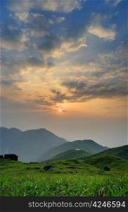 Sunrise from the Sunset Peak, Hong Kong. The grass in the front.