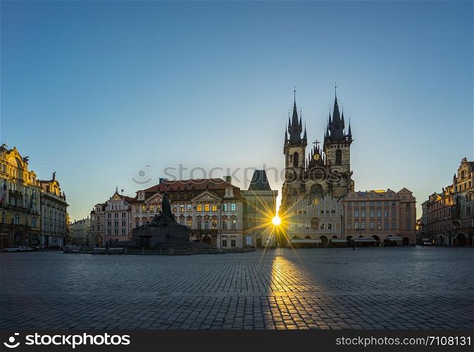 Sunrise in Prague old town square with view of Tyn Church in Czech Republic.