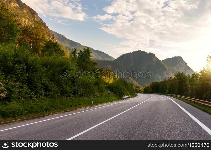 Sunrise in the Alps, view of the mountain highway.. Sunrise in the Alps, view of the mountain highway