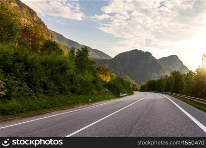 Sunrise in the Alps, view of the mountain highway.. Sunrise in the Alps, view of the mountain highway