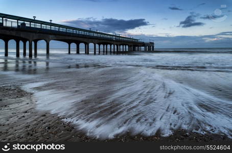 Sunrise landscape of pier stretching out into sea