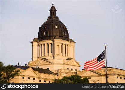 Sunrise lights up the capitol dome in Pierre, SD