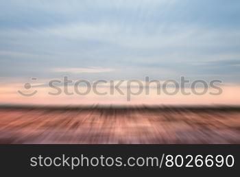 Sunrise on the lake with beautiful sky with motion blur background