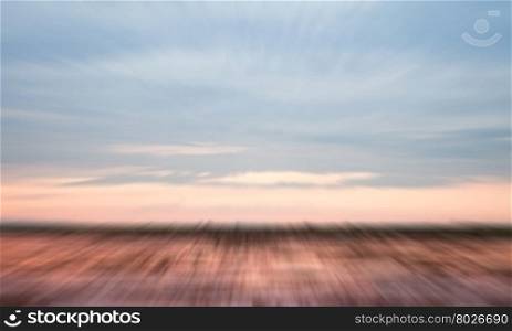 Sunrise on the lake with beautiful sky with motion blur background