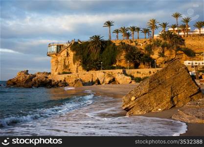 Sunrise on the picturesque coastline of the Mediterranean Sea and Balcon de Europa famous vantage point in resort town of Nerja, Costa del Sol, Spain.
