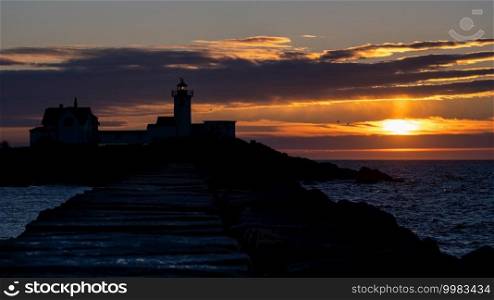 Sunrise over a lighthouse on the Atlantic