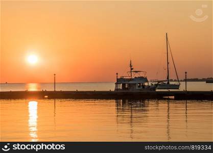 Sunrise over boats and the pier, Kos, Greece