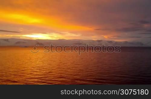 Sunrise over Brabant Island, Gerlache Strait, Antarctica. Brabant island is the second largest island in the Palmer Archipelago. Large ice-cliffs protect its coastline from the sea.