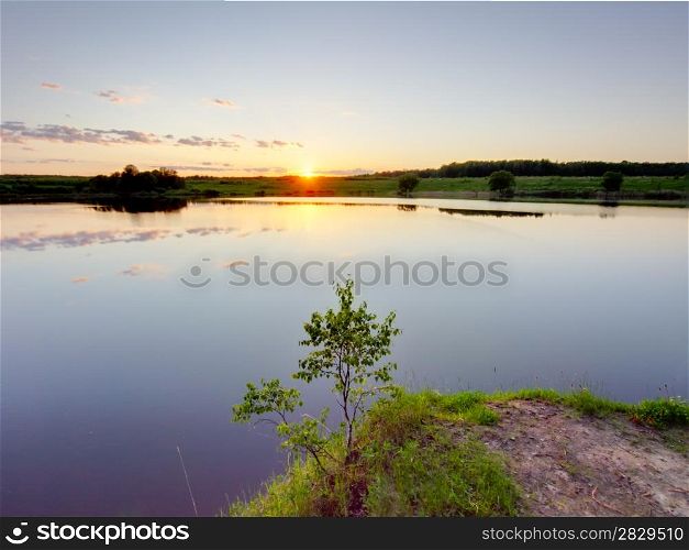 Sunrise over lake. Summer sunset on a lake. Ruza reservoir in Russia.