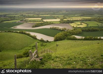 Sunrise over rolling English countryside landscape in Spring