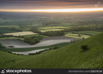 Sunrise over rolling English countryside landscape in Spring