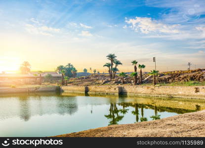 Sunrise over Sacred lake in Karnak Temple, Luxor. Sacred lake in Karnak Temple