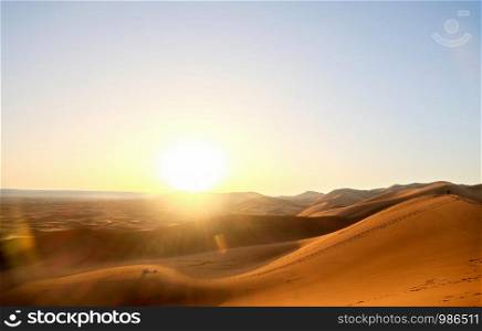 Sunrise over sand dunes at Erg Chebbi, Sahara desert. Merzouga, Morocco.