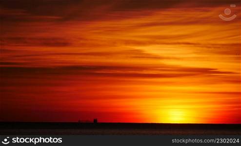 Sunrise over sea. Red sky over water surface. Sun up above horizon. Morning seascape.. Sunrise over sea. Morning seascape.
