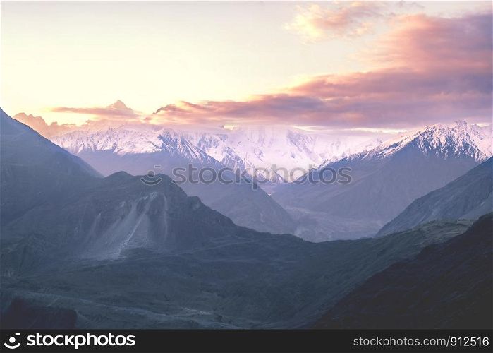 Sunrise over snow capped Karakoram mountain range in Nagar valley. Gilgit Baltistan, northern Pakistan.