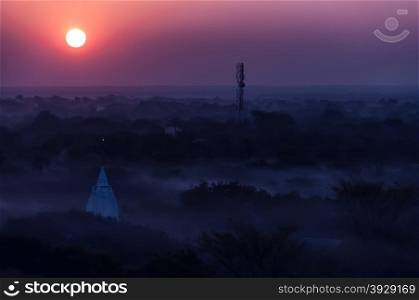Sunrise over temples of misty and foggy Bagan in Myanmar. Sunrise over temples of misty and foggy Bagan in Myanmar Burma