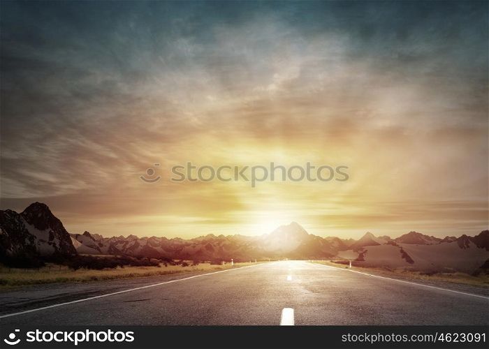 Sunrise over the road. Picturesque landscape scene and sunrise above road