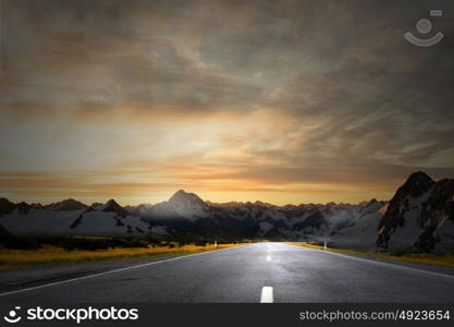 Sunrise over the road. Picturesque landscape scene and sunrise above road