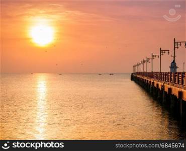 Sunrise over the sea with bridge and lighthouse at prachuapkhirikhan,Thailand