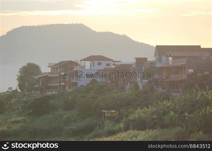 sunrise over the village with mountain background. sunrise over the village