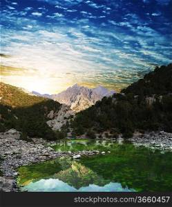 Sunrise scene on mountains lake