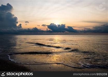 Sunrise sky and beach wave background.