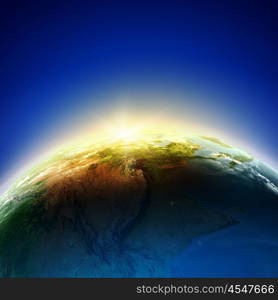 Sunrise. Sun rising above Earth planet. Conceptual photo. Elements of this image are furnished by NASA