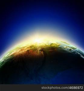 Sunrise. Sun rising above Earth planet. Conceptual photo. Elements of this image are furnished by NASA