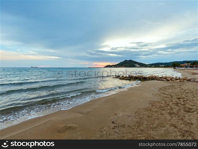 Sunrise view from beach. Summer coastline (Greece, Zakynthos, Alykes, Ionian Sea).