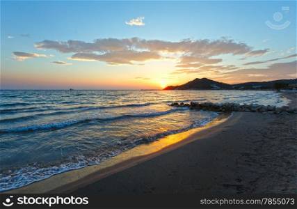 Sunrise view from beach. Summer coastline (Greece, Zakynthos, Alykes, Ionian Sea).