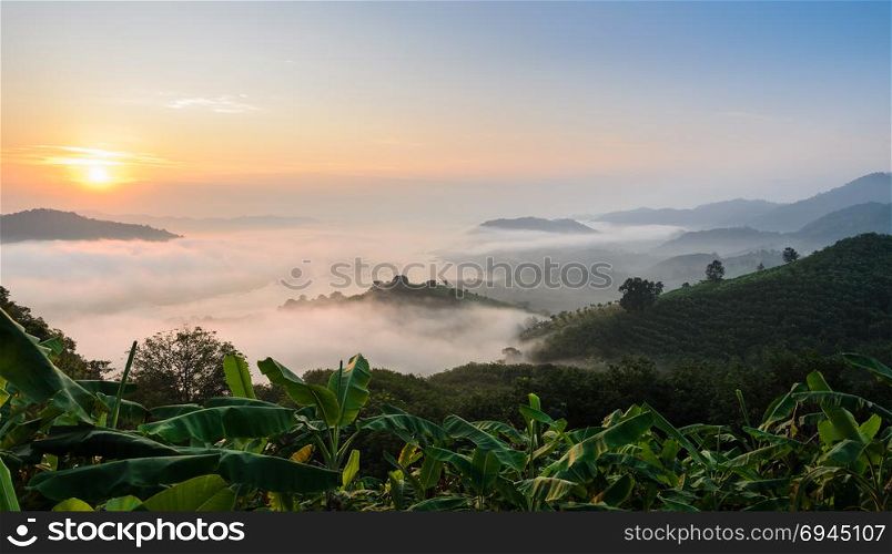 Sunrise with sea of fog above Mekong river at Phu Huai Isan mountain viewpoint in Nong Khai Province, Thailand