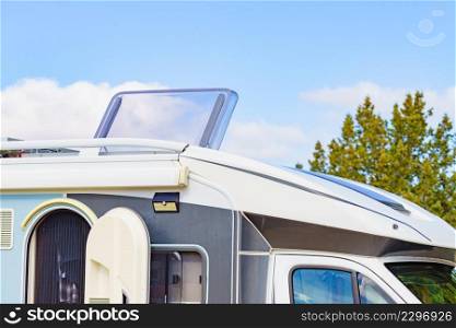 Sunroof, raisable panel window on roof top of rv camper vehicle. Traveling by motorhome.. Sunroof, raisable window on roof top of camper