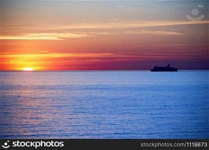 sunset above ocean while cruising through sea