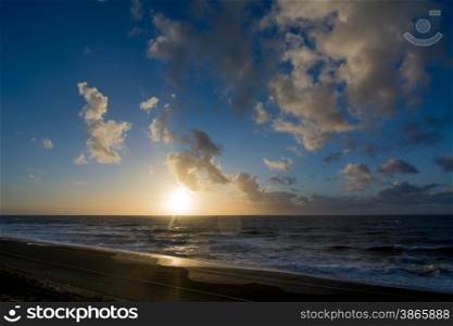 sunset and cloudscape above the dutch sea