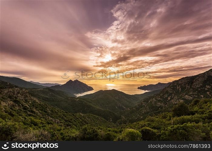 Sunset and dramatic sky on the west coast of Corsica