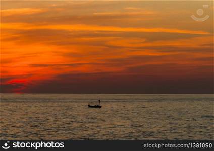 Sunset and fishing boat in Turkey